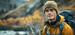 A dedicated conservationist in the field the photo captures a young male environmentalist in outdoor gear