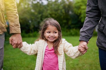 Sticker - Smile, parents and child holding hands in park with care, support and trust on outdoor adventure. Love, fun and face of girl with family in garden for happy holiday, nature or walking in backyard