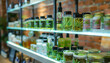 
Cannabis products with the characteristic branding of cannabis leaves on a shelf of dispensary, shop, pharmacy. Medical marijuana and CBD products