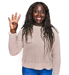 Poster - Young african woman wearing wool winter sweater showing and pointing up with fingers number four while smiling confident and happy.