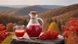 freshly squeezed thick natural juice with pulp of ripe red viburnum on autumn hills background