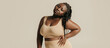 © gstockstudio - Beautiful young curvy woman in underwear looking confident in her body on studio background
