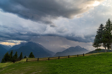 Wall Mural - Stormy clouds over the mountains of Valle d'Aosta