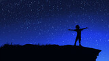 Fototapeta Kosmos - Silhouette of a happy boy against a starry night sky background