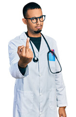 Wall Mural - Young african american man wearing doctor uniform and stethoscope showing middle finger, impolite and rude fuck off expression