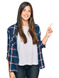 © Krakenimages.com - Young brunette woman wearing casual clothes smiling happy pointing with hand and finger to the side