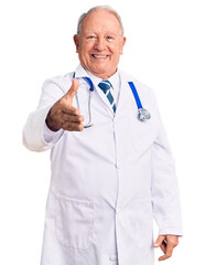 Canvas Print - Senior handsome grey-haired man wearing doctor coat and stethoscope smiling friendly offering handshake as greeting and welcoming. successful business.