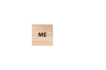 wooden cubes with the inscription Me on a white isolated background close-up