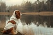 A loyal Cavalier King Charles Spaniel standing guard at the edge of a tranquil lake, its unwavering devotion evident in every vigilant gaze,