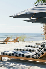 Wooden lounge chairs with blue sun umbrellas on a sandy beach