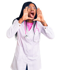 Poster - Young african american woman wearing doctor stethoscope shouting angry out loud with hands over mouth