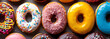 Many sweet donuts with colorful glaze cream
