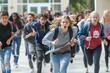 © blvdone - Crowd of teenagers students running away from school in panic