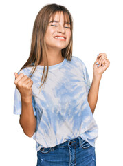 Wall Mural - Teenager caucasian girl wearing casual clothes very happy and excited doing winner gesture with arms raised, smiling and screaming for success. celebration concept.