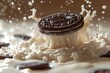 Chocolate cookies with creamy filling dramatically fall into the milk, crumbling into pieces, milk splashes flying around. Cookie advertising concept