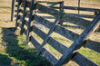 Leaning wooden corral fence