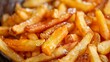 Close up view of golden crispy french fries cooking in a deep fryer, delicious fast food preparation