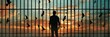 © Zahid - Man silhouetted against a backdrop of prison bars, with the sky and departing birds serving as a metaphor for freedom. Idea regarding psychology, psychiatry, faith, liberty, and incarceration