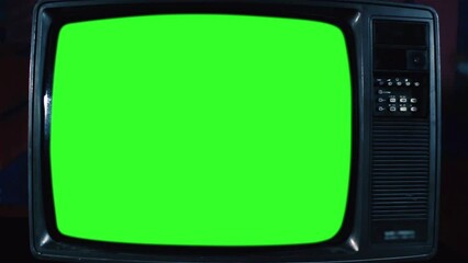 Wall Mural - old analogue television turning on chroma key green screen. front angle view. you can replace green 