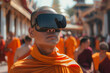 A serene monk in traditional orange robes engages with virtual reality technology amidst a background of blurred statues of meditating figures.