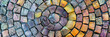 circular pattern of colorful stone tiles arranged in an intricate spiral, generative AI