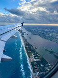 Fototapeta Zwierzęta - view from plane window over Palm Beach at sunrise