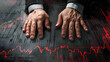 Close-up of hands gripped in despair over a plunging market graph, symbolizing economic crisis anguish.