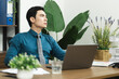 © Q88 - Image of Asian male businessman working in the office