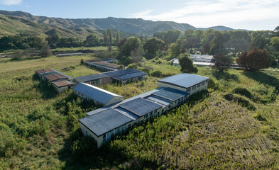 Wall Mural - Destroyed and abandoned school one year after the Tropical Cyclone Gabrielle distaster that overflowed the Eskdale river. Eskdale, Napier, Hawkes bay, New Zealand.