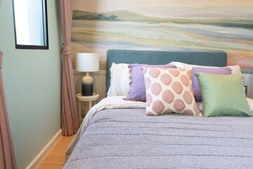 Wall Mural - Contemporary bedroom interior in pastel colors with table lamp, in warm sunlight.