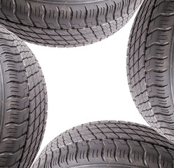 Poster - A spare tire for summer tires for seasonal car repairs in a car service. Part of a wheel on a white isolated background in a photo studio.