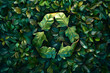 A recycling symbol made of leaves is seen in front of a background of green leaves.