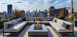 A serene rooftop terrace with lounge seating, a fire pit, and panoramic city views.
