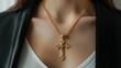 A golden cross pendant on the neck of a woman. Faith concept.