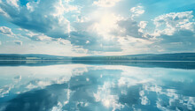 A Beautiful Lake With A Blue Sky And Clouds