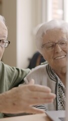 Wall Mural - Senior people talking during online meeting using laptop in geriatric