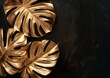 Three golden leaves stand out against a dark black backdrop, creating a striking contrast in colors and textures