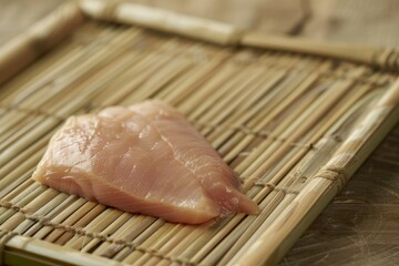 Wall Mural - Intimate Detail of Uncooked Chicken Fillet on Bamboo