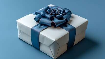 Wall Mural -  a white gift box with a blue ribbon and a flower on the top of it, on a blue background.