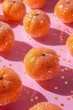 Orange fruit adorned with glitter and sequinas on a pastel pink background. Aesthetic juicy Summer concept with long shadow. 