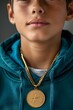 Teenage boy dressed in a tracksuit with a gold medal around his neck. Image from the olympic games