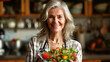 Aged woman smiling happily and holding a healthy vegetable salad bowl on blurred kitchen background Copy Space healthy lifestyle vegan cooking at home