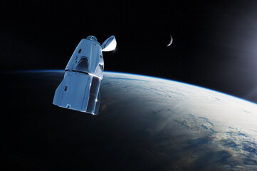 Wall Mural - cargo spacecraft in low-earth orbit with sunlight. elements of this image furnished by nasa.