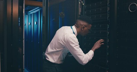 Fototapete - Black man in server room with tablet, inspection or network maintenance with engineer in database storage update. Tech service, system administration or technician on digital app checking data center