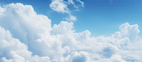 Wall Mural - High above, a commercial airliner gracefully navigates through a vast expanse of fluffy white clouds in the blue sky