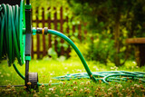Garden hose for watering plants in garden