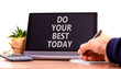 Do your best today symbol. Concept words Do your best today on beautiful black tablet. Beautiful white background. Businessman hand. Business motivational do your best today concept. Copy space.