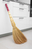 Fototapeta Uliczki - Household used of straw broom for floor dust cleaning