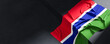 Flag of Gambia. Fabric textured Gambia flag isolated on dark background. 3D illustration