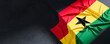 Flag of Ghana. Fabric textured Ghana flag isolated on dark background. 3D illustration